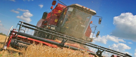 photo of agriculture tractor at work in field of crops - credit SRUC