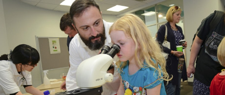 photo of young participant looking into a microscope at Easter Bush Campus Open Day