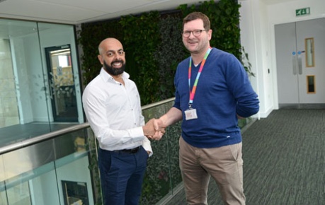 photo of Jaymin Amin, COO Ingenza and John Mackenzie CEO Roslin Innovation Centre shaking hands inside the building - image credit Norrie Russell, UoE