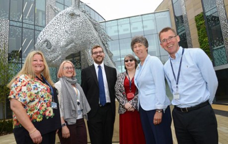 Photo of Liz Smith MSP, Oliver Mundell MSP and staff of The Roslin Institute and EBSOC outside the entrance to the Chrnock Bradley Building by Canter the horse sculpture - image credit University of Edinburgh, The Roslin Institute