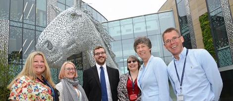 photo of University of Edinburgh management team with MSPs Liz Smith and Oliver Mundell in front of horse statue, Canter - image credit University of Edinburgh