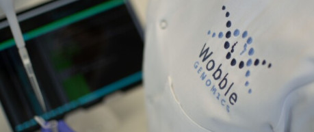 Close-up of Wobble Genomics branded lab coat - credit Wobble Genomics