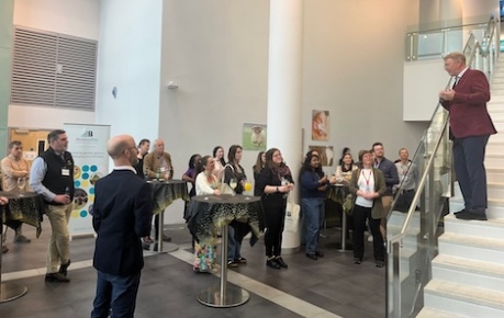 AbacusBio gather with guests in Roslin Innovation Centre atrium space